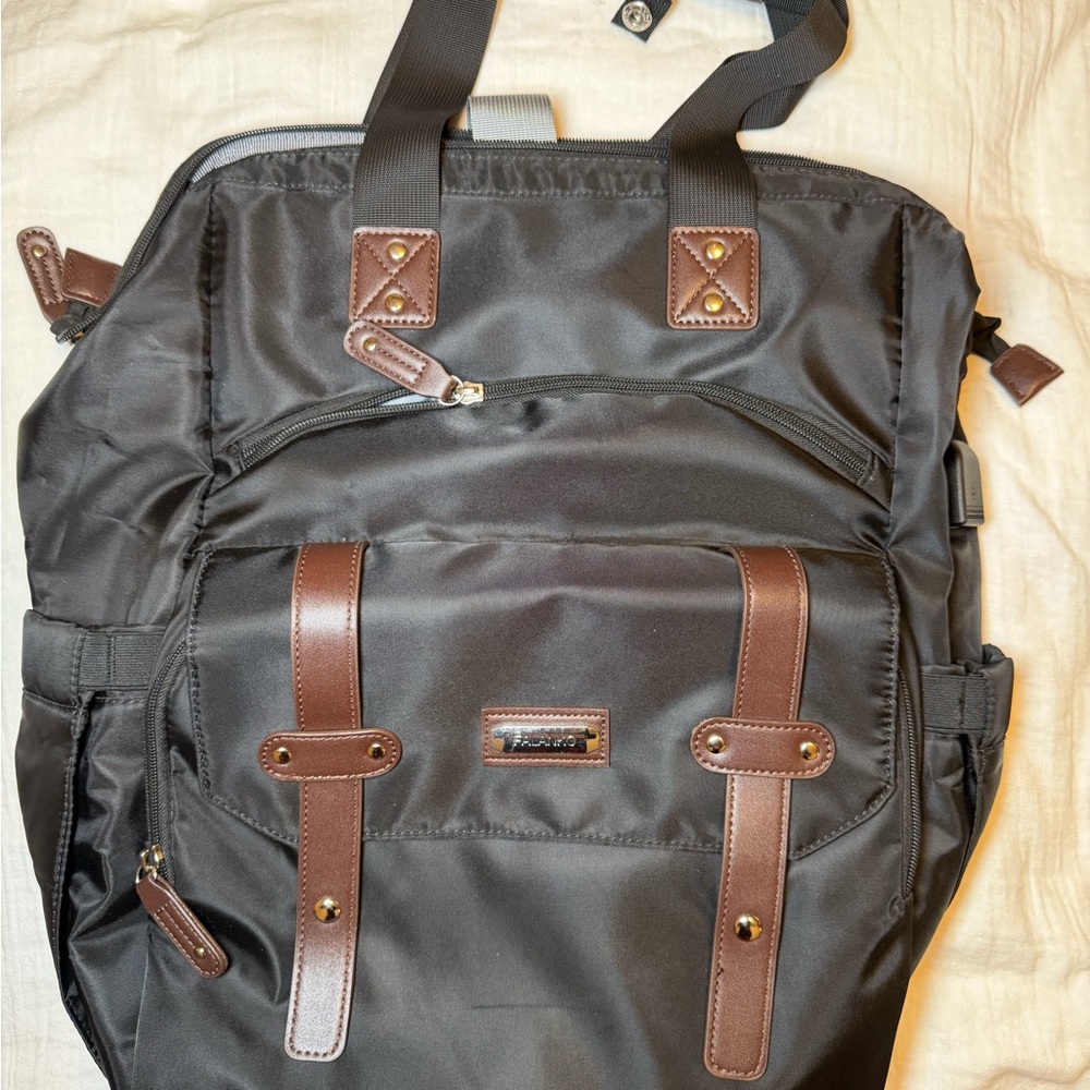 black Falanko laptop backpack with brown faux-leather accents.